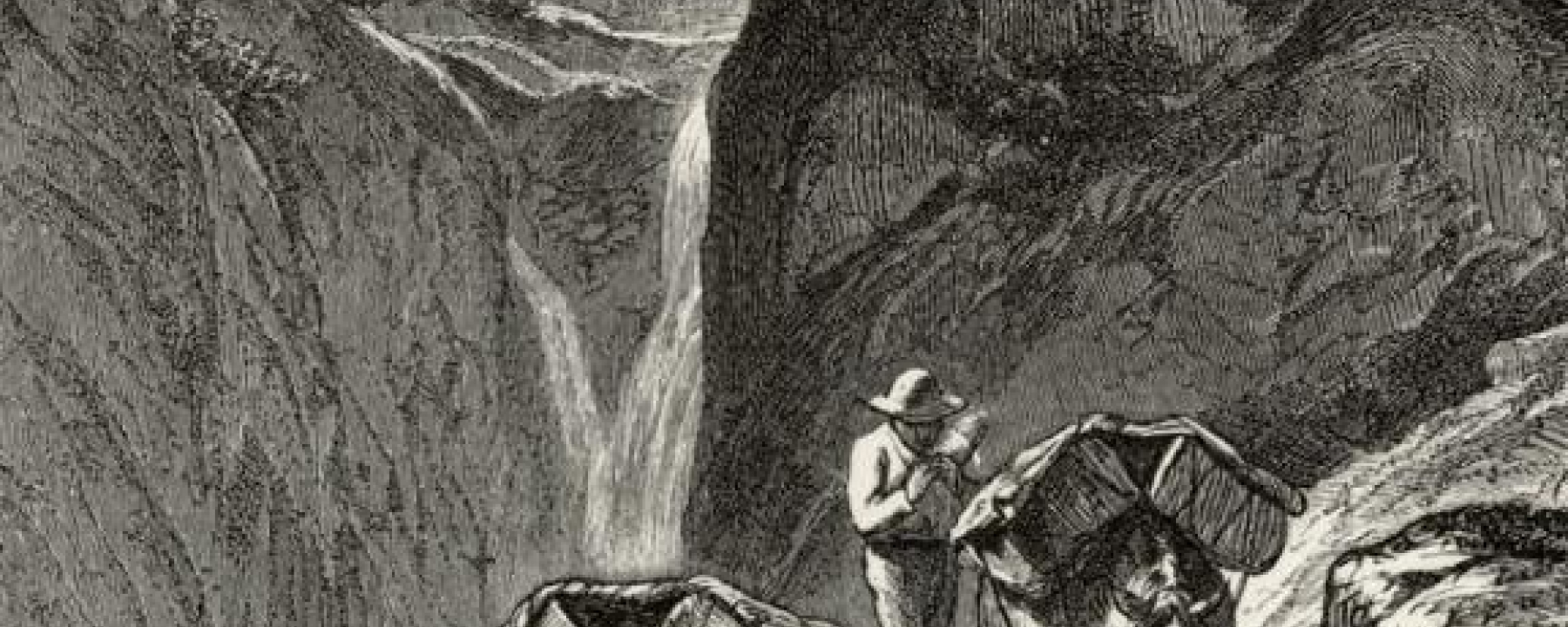 Beladene Saumpferde in einer Bergschlucht.